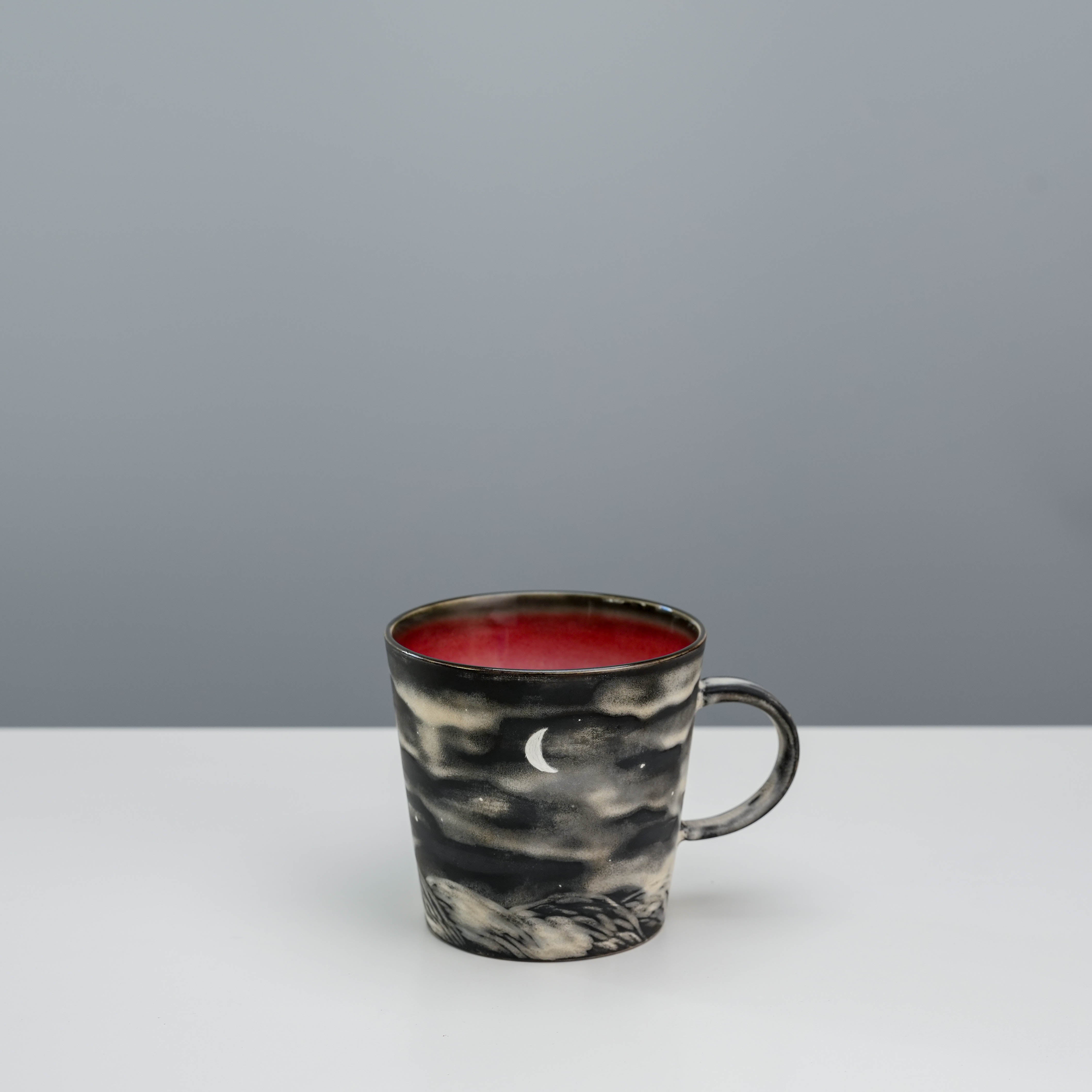 Moon-themed tapered mug