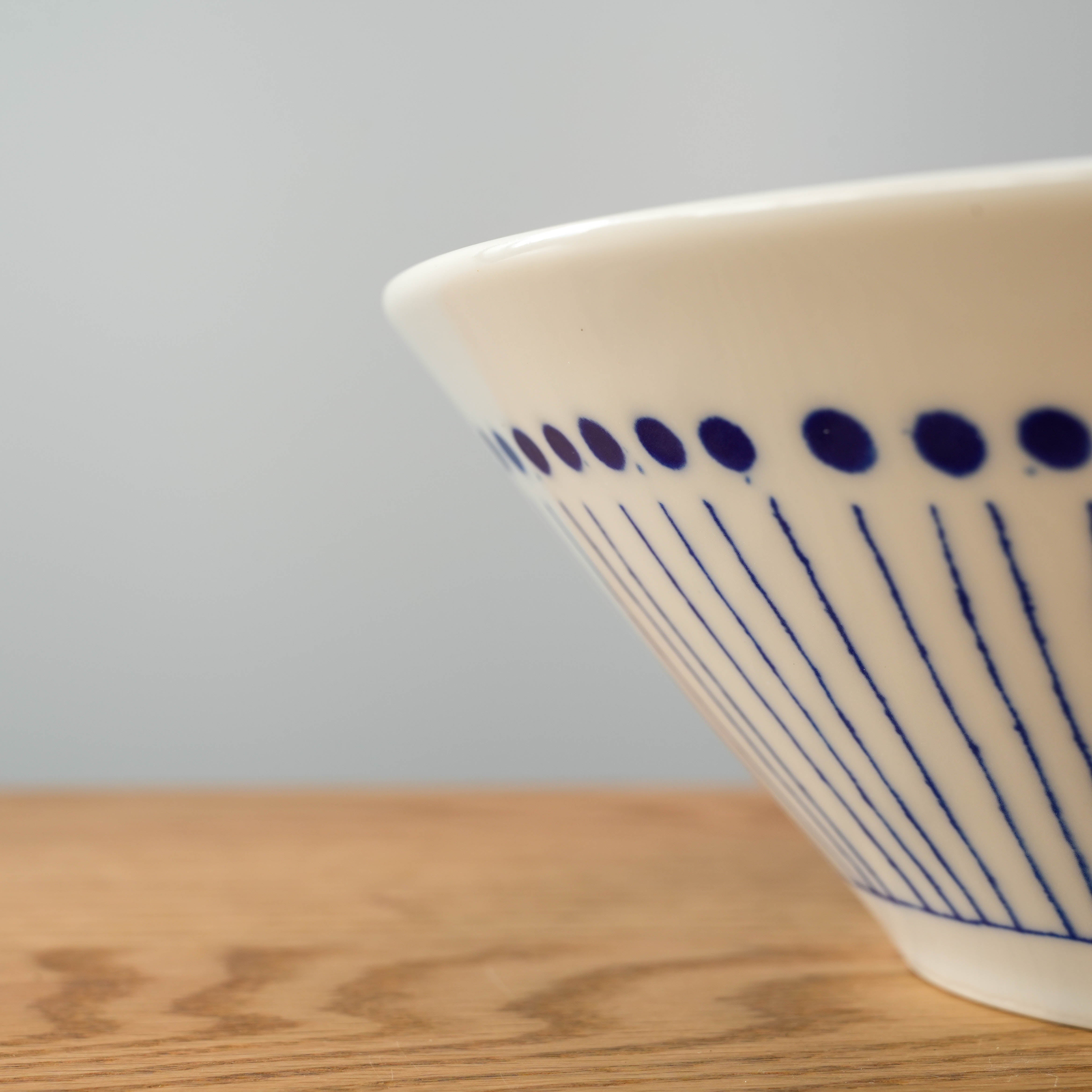 Flared serving bowl with dot pattern