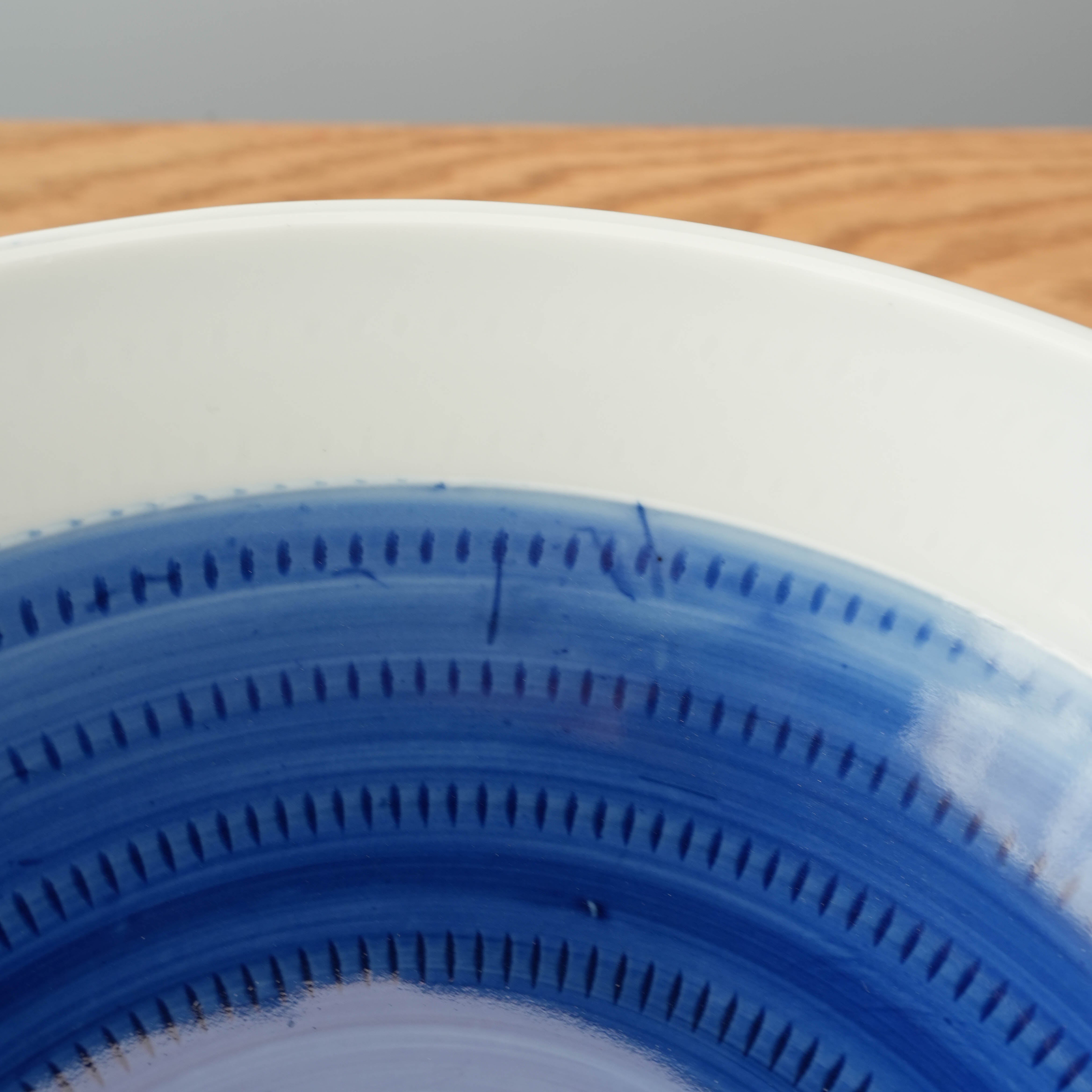 Footed bowl with concentric patterns