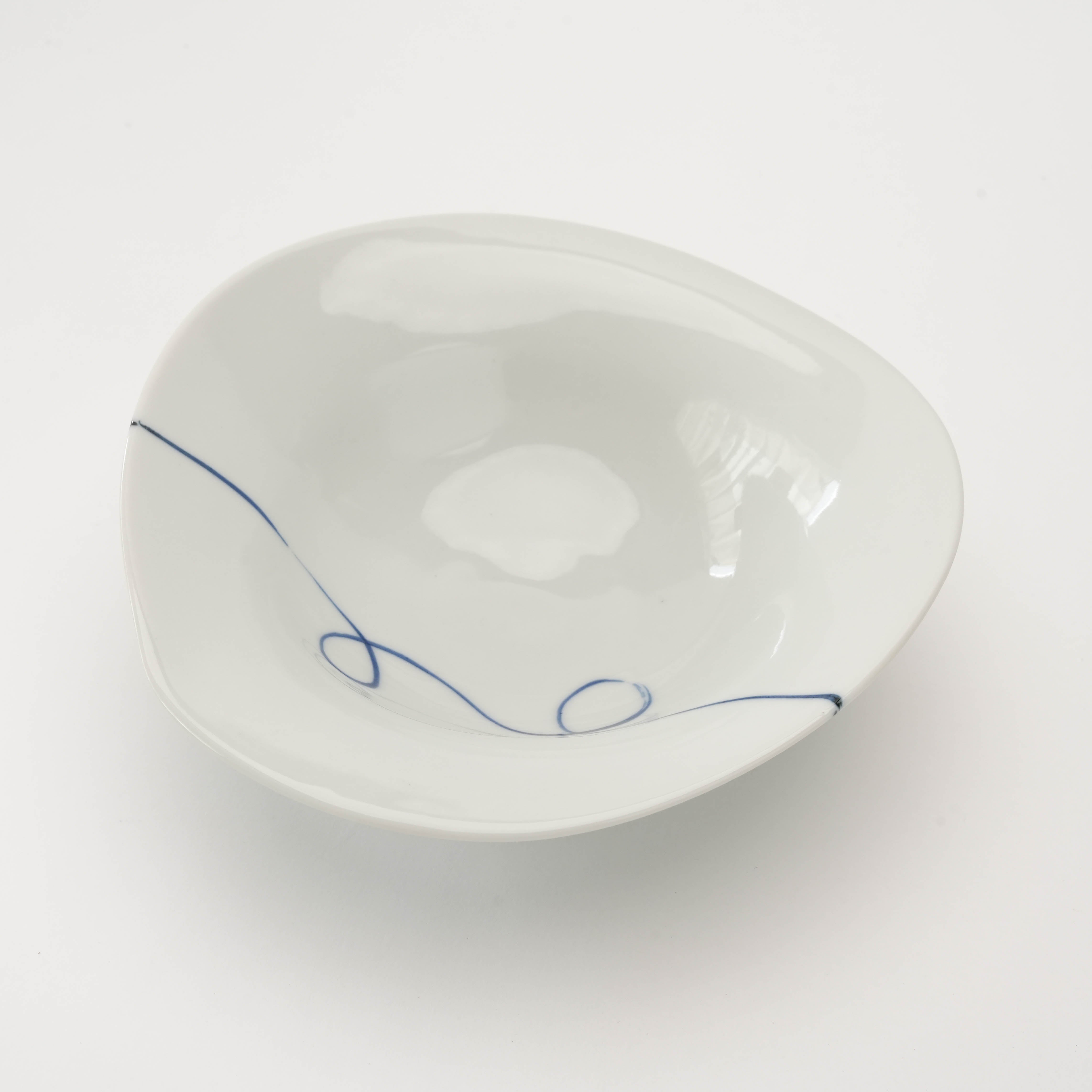 Asymmetrical footed serving bowl