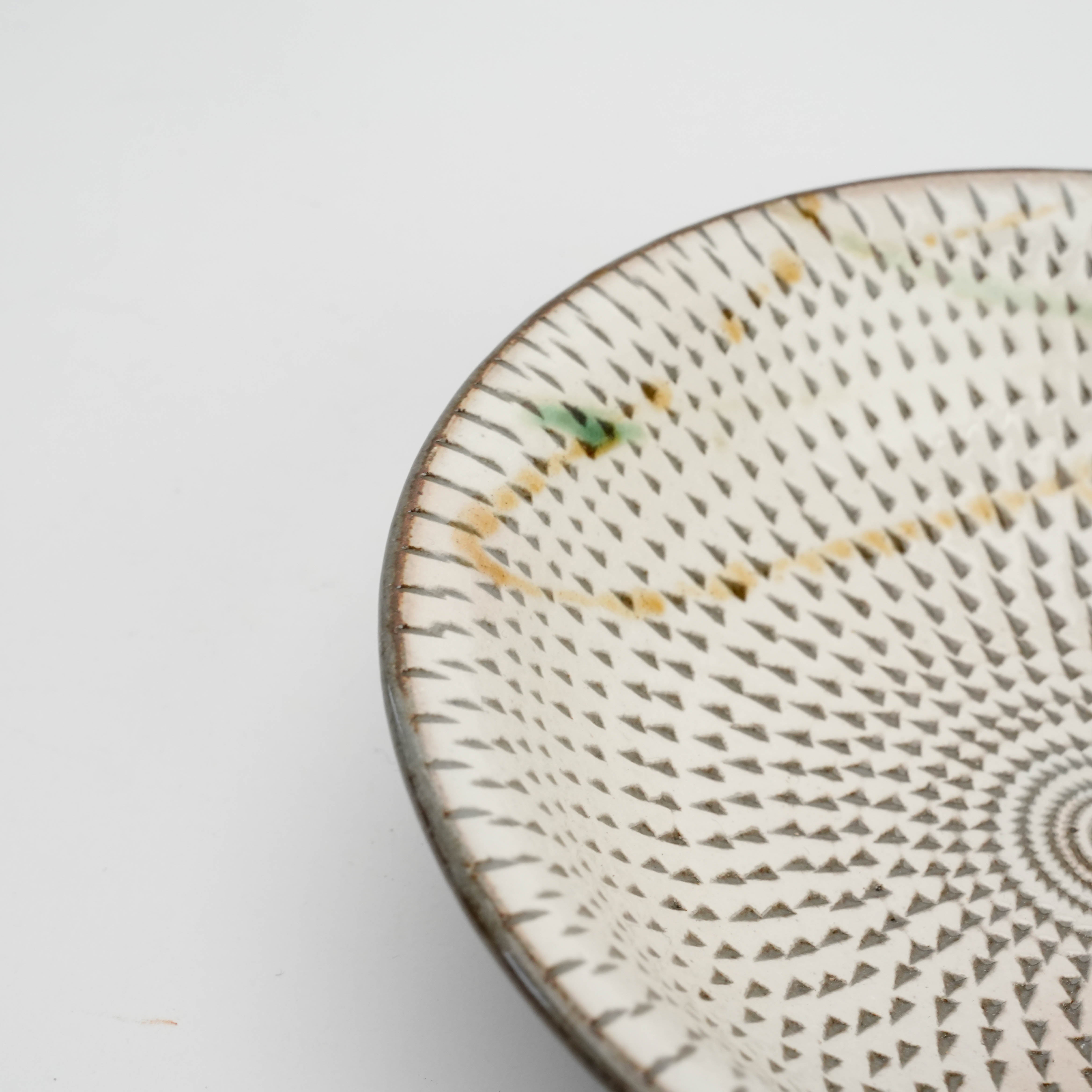 Triangular pattern footed dish