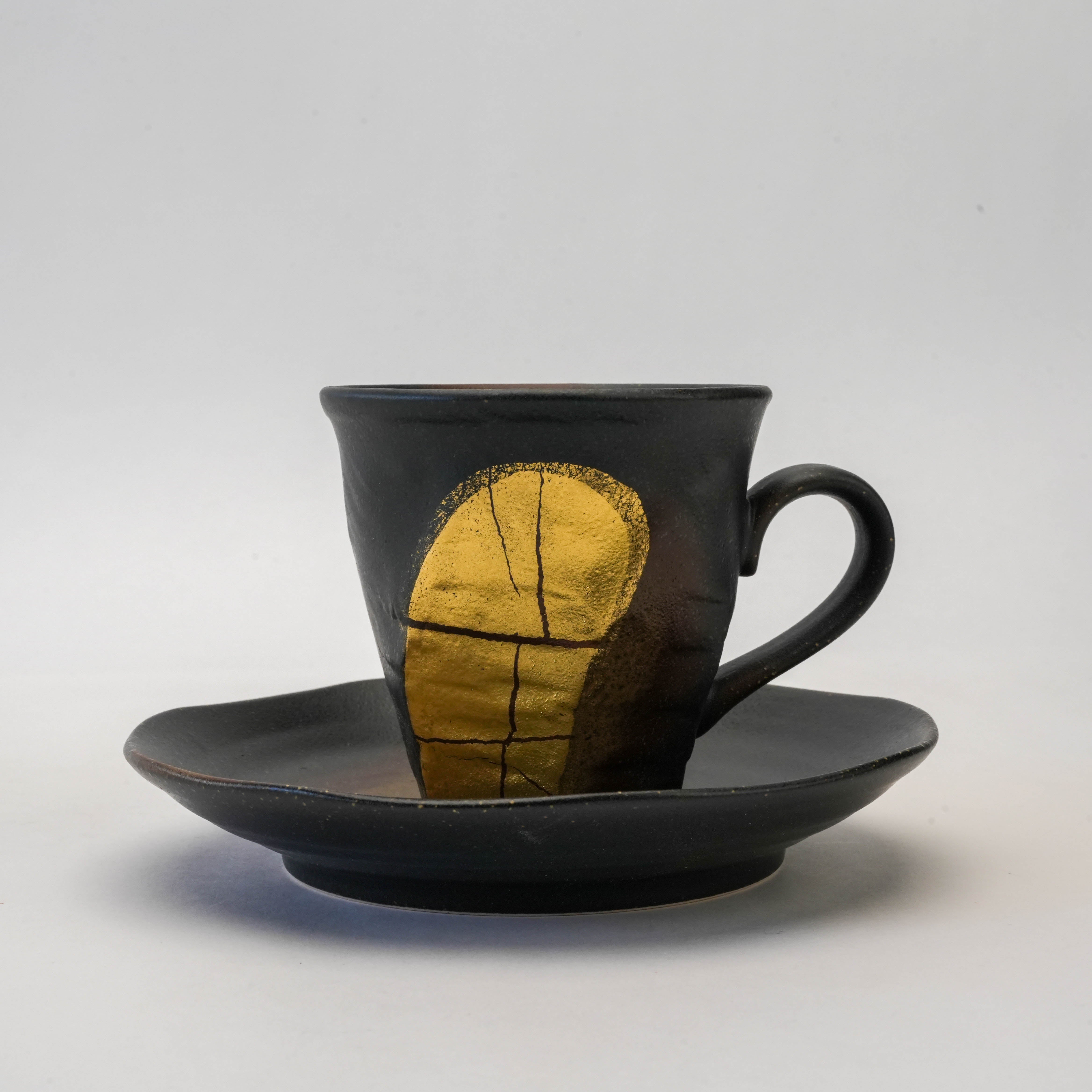 Curved Coffee Cup and Saucer Set